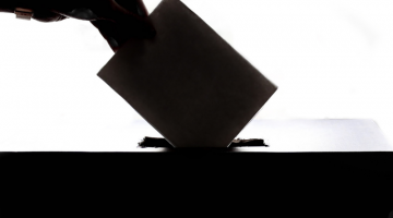 Image of someone voting